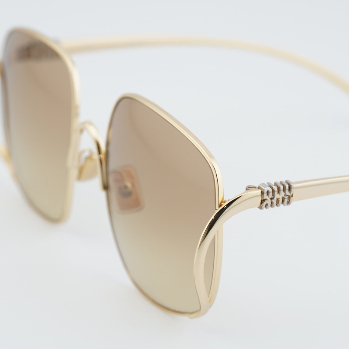 Lentes de Sol Miu Miu MUA57S 5AK20S 57-20-140