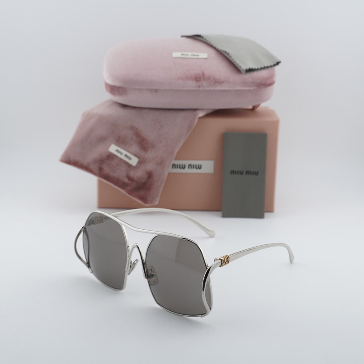 Lentes de Sol Miu Miu MUA55S 1BC80Q 57-18-140
